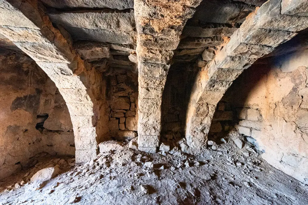 Basalt arches inside the fort of Deir al-Kahf