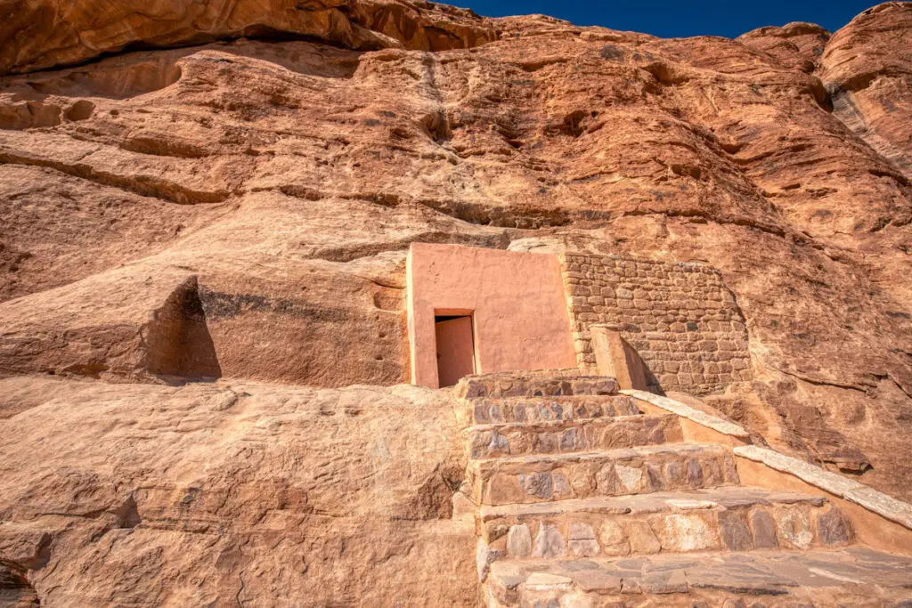 Rock-cut doorway and steps leading into the Nabataean water reservoir near Little Petra, Jordan