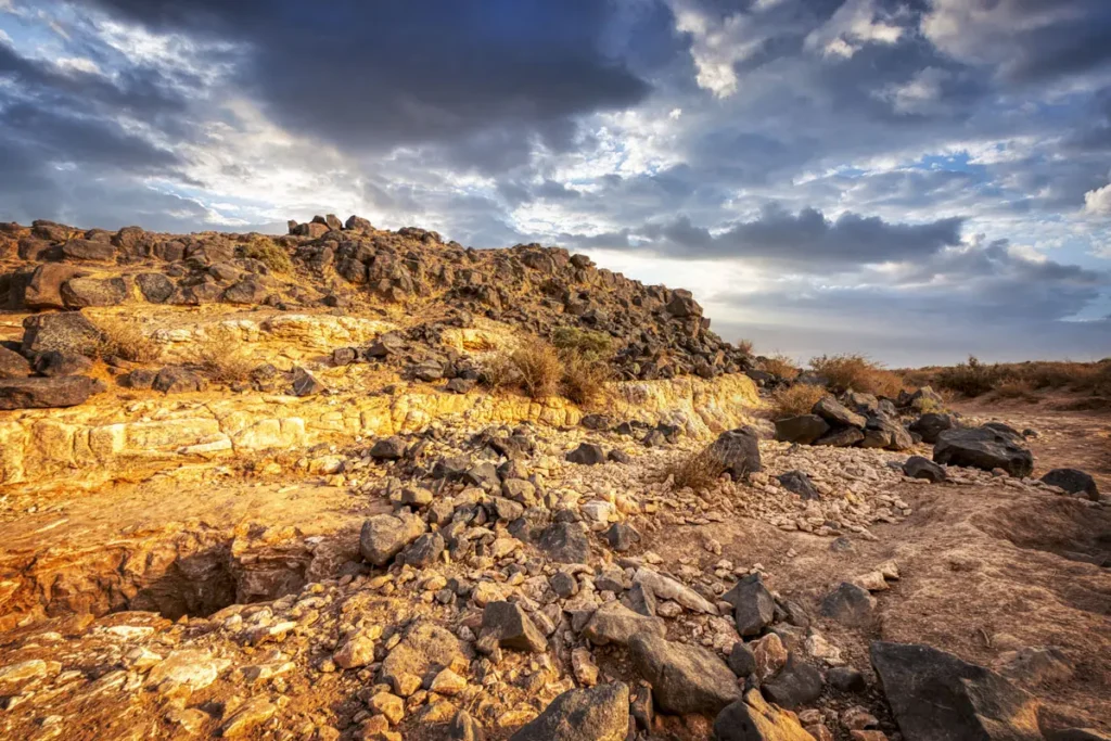 The basalt ruins of the fort on its spur, Qasr Uweinid, Jordan