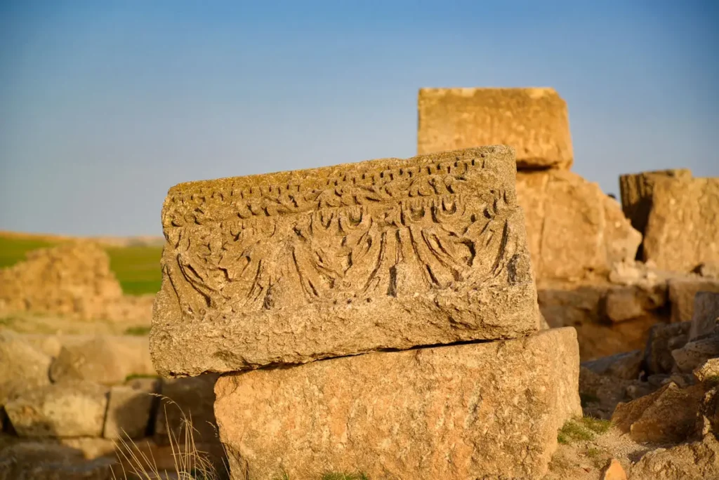 A carved stone block resting on a wall, Qasr Al-Mushatta, Jordan