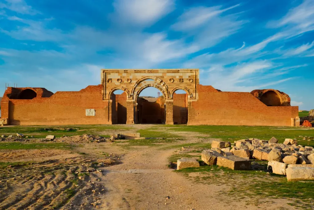 A path leading towards the triple arch and brick walls, Qasr Al-Mushatta, Jordan
