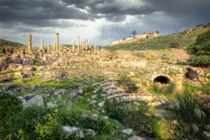 The Roman Odeon and ruins on the green hillside, Pella, Jordan