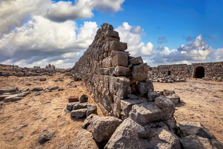 A long wall of stacked basalt blocks, Qasr Deir Al-Kahf, Jordan