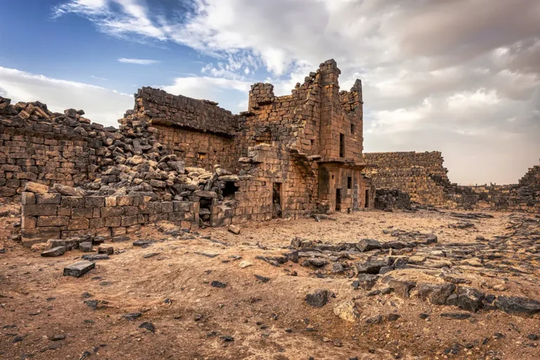 The ruined basalt walls of a house in the town, Umm El-Jimal, Jordan