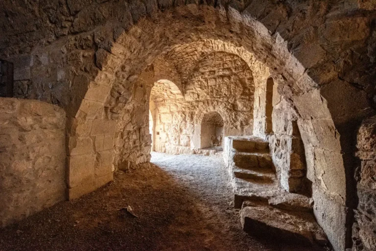 A vaulted room with arches and stone steps, Karak Castle, Jordan
