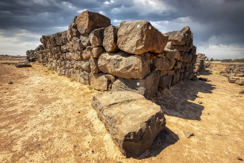 A corner of the basalt walls with a fallen block, Qasr Ain Es-Sil, Jordan