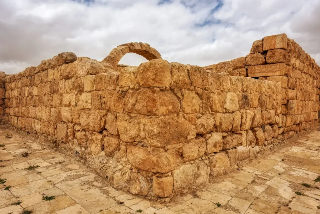 The remains of an arch rising from a palace wall, Qasr Al-Hallabat, Jordan