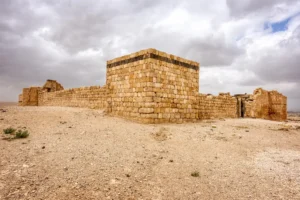 The square tower and walls of the fort on its hill, Qasr Al-Hallabat, Jordan