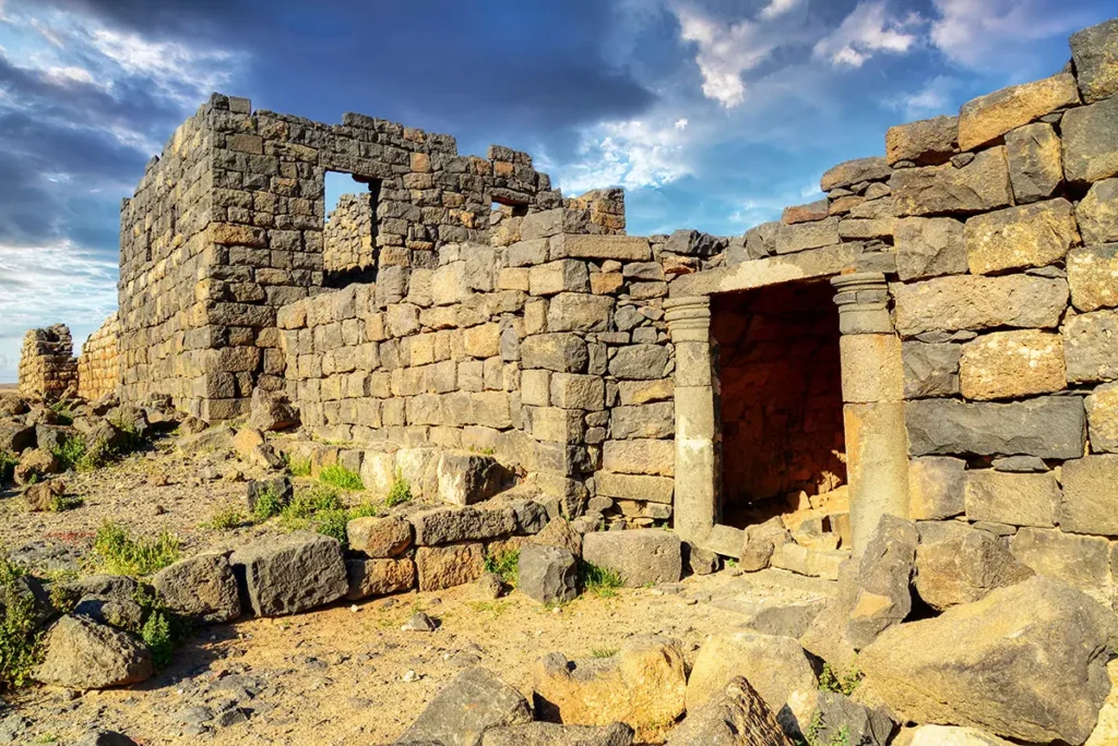 The entrance to the castle in the high basalt walls, Qasr Deir Al-Kahf, Jordan
