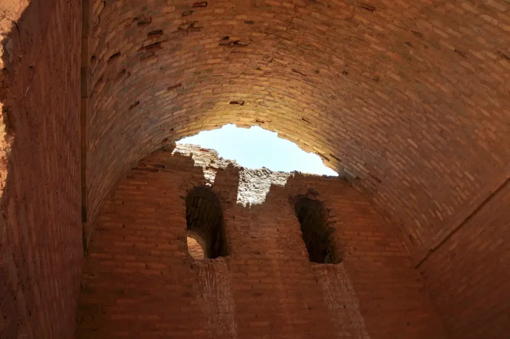 A brick vault open to the sky through its broken crown, Qasr Tuba, Jordan