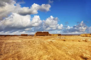 White clouds over the palace on the horizon, Qasr Tuba, Jordan